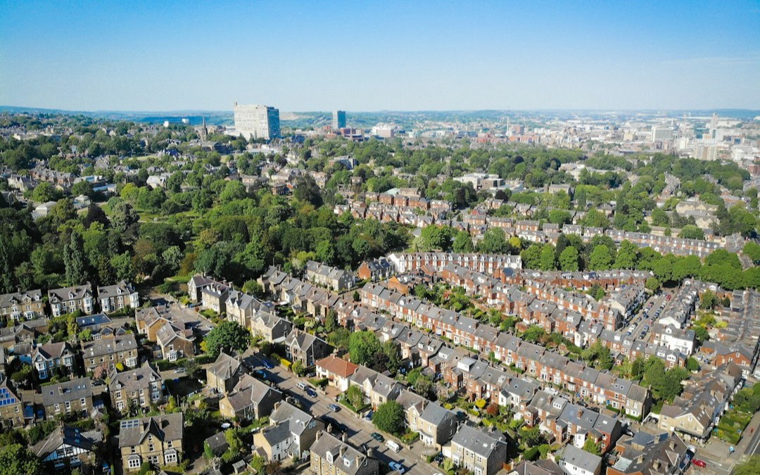an aerial view of a city with lots of houses