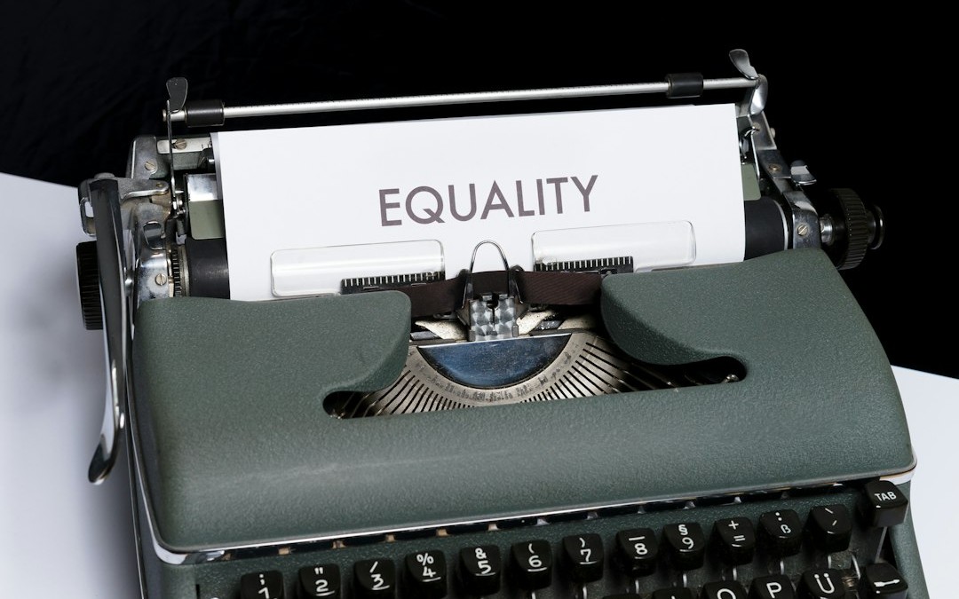 a typewriter with a paper that reads equality