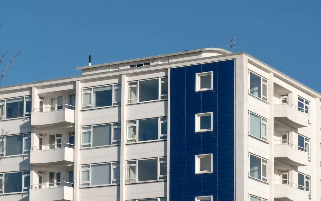 white and blue concrete building under blue sky during daytime